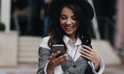 smiling woman on her phone